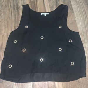 It’s a black crop top with bling on it!